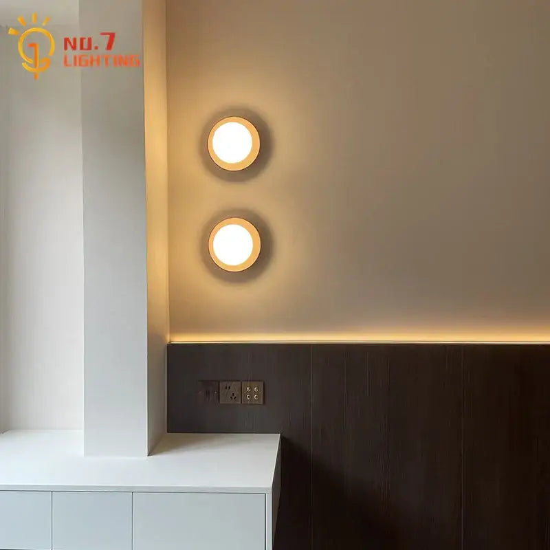 Two circular recessed black walnut wall lamps with warm soft illumination for bedroom and living room decorbites black walnut