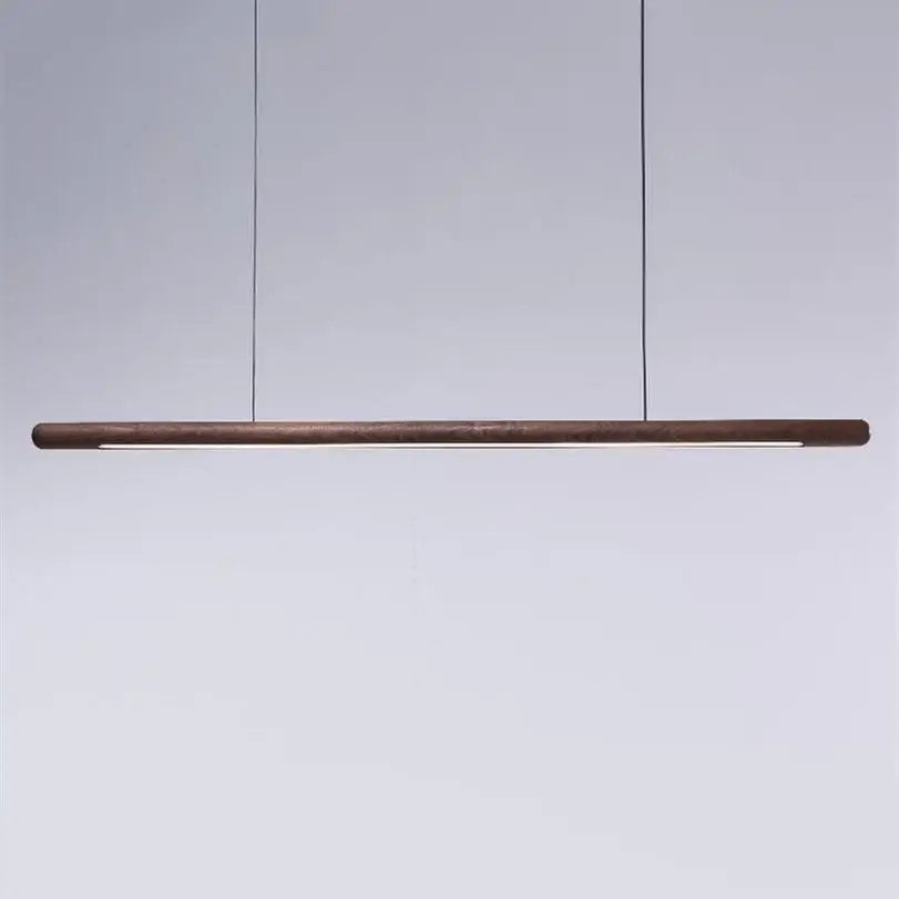 Minimalist black walnut wood pendant lights with sleek cylindrical body suspended by thin black cords for dining room decorbites black walnut