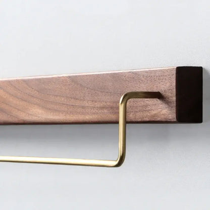 Minimalist towel rack with brass accents mounted on black walnut wood base for bathroom use in a 2 pack set