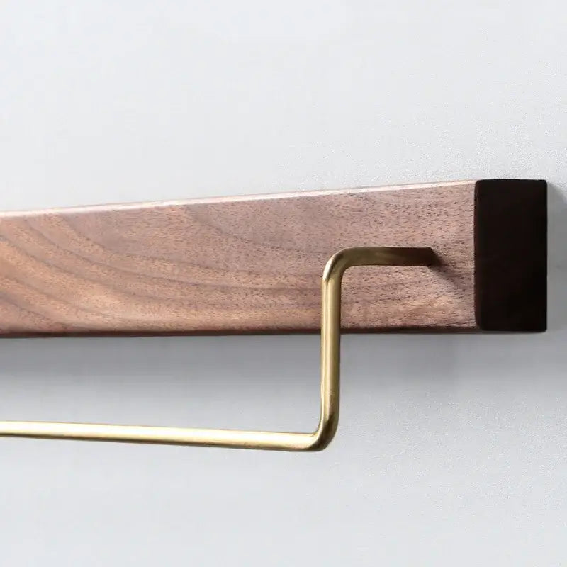 Minimalist towel rack with brass accents mounted on black walnut wood base for bathroom use in a 2 pack set