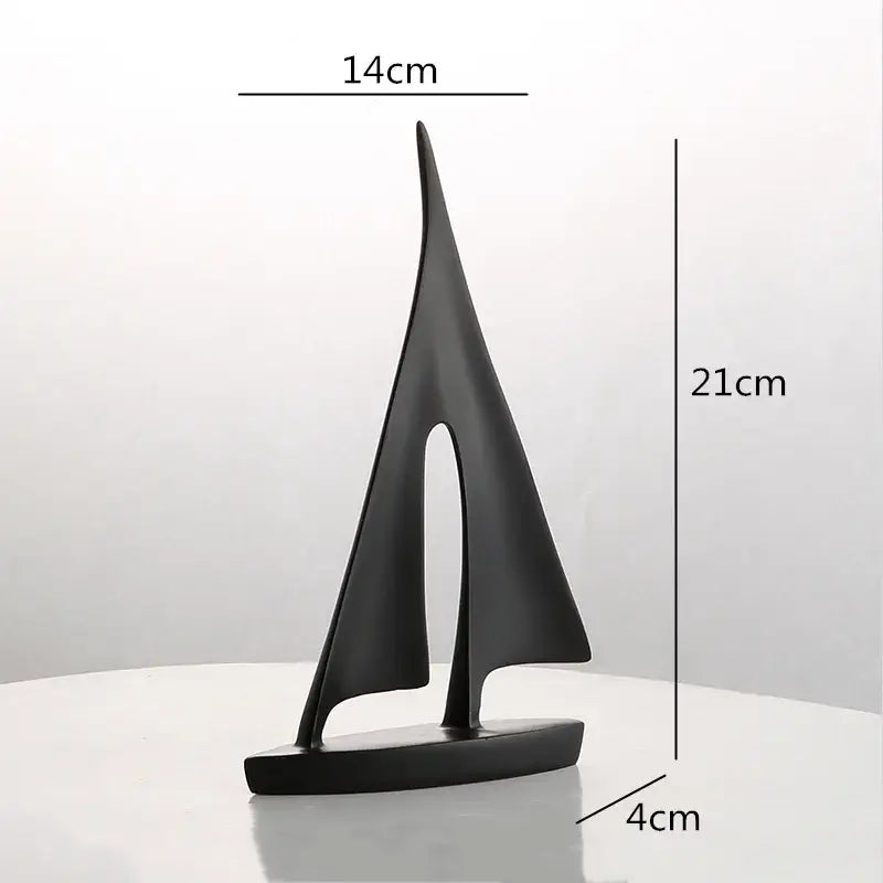 Minimalist black matte resin sailboat figurine with sleek modern design for abstract resin sailboat living room decorbites decor