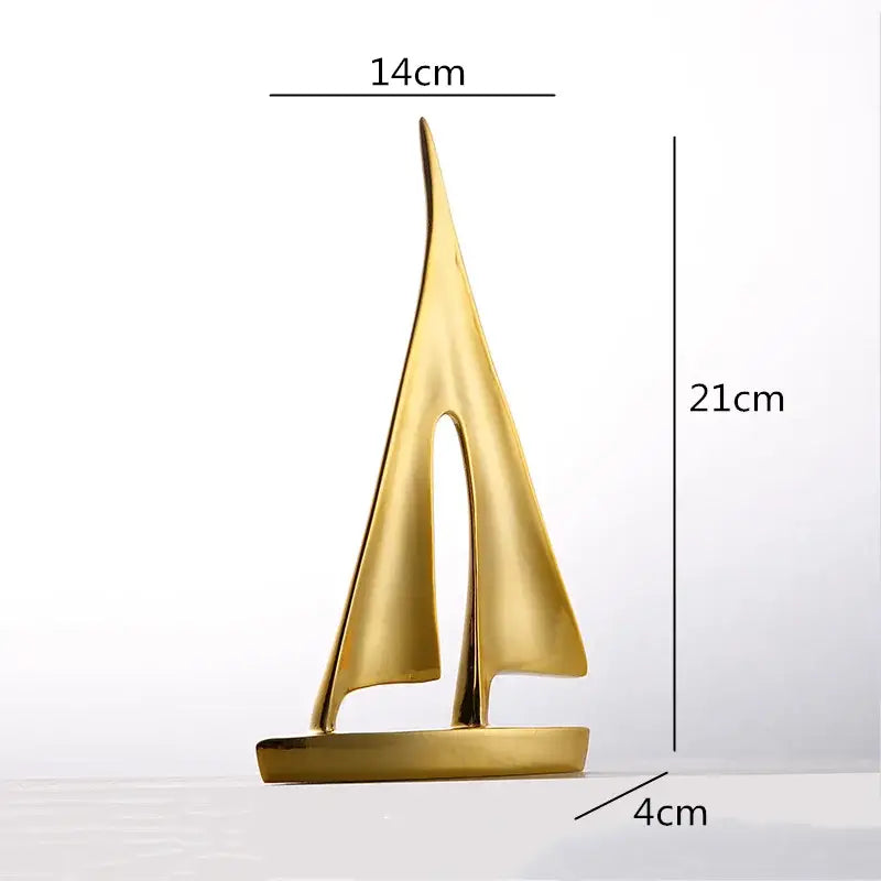 Golden metallic abstract resin sailboat sculpture with sleek minimalist design for decorbites abstract resin living room decor