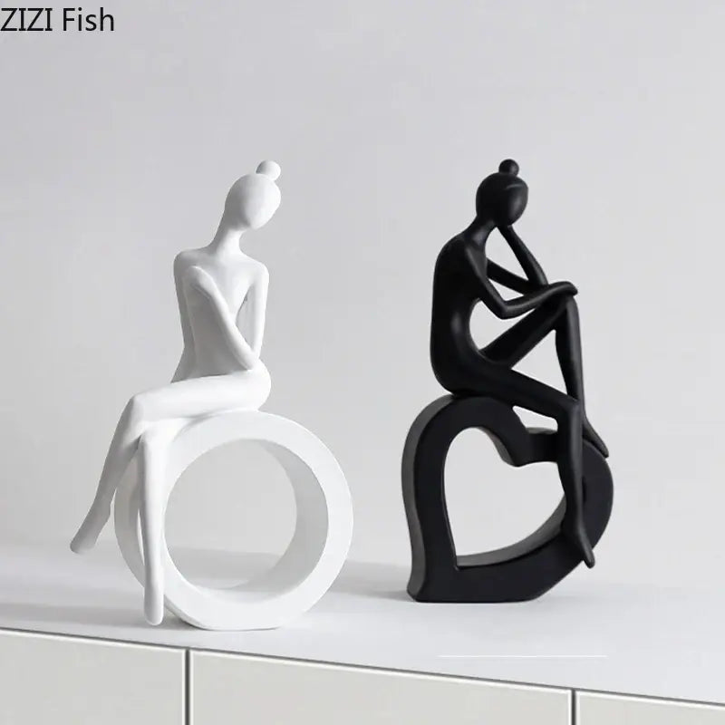 Two minimalist black and white abstract resin sculpture figurines by decorbites for living room decor