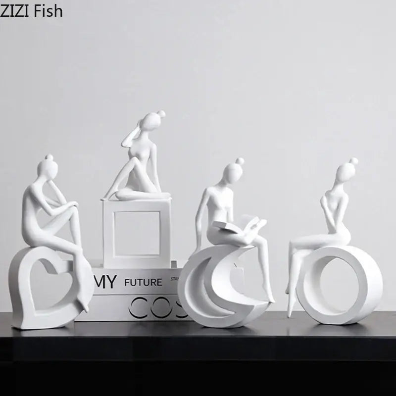 Set of four minimalist white resin abstract resin sculpture figurines depicting stylized women by decorbites for living room decor