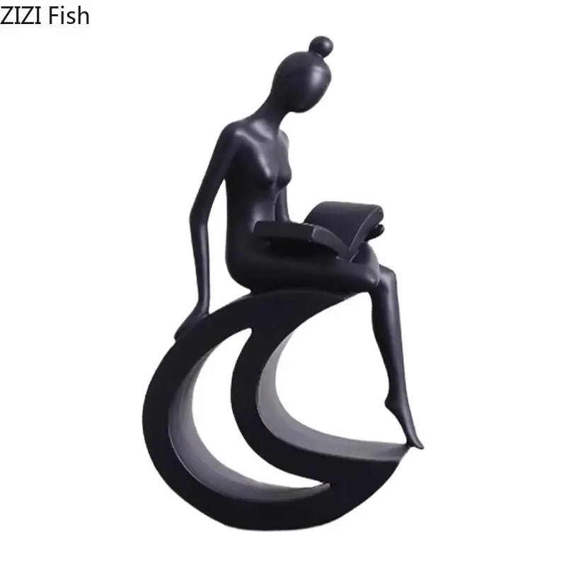 Black glossy resin figurine of a stylized woman reading on a crescent base decorbites abstract resin sculpture decor