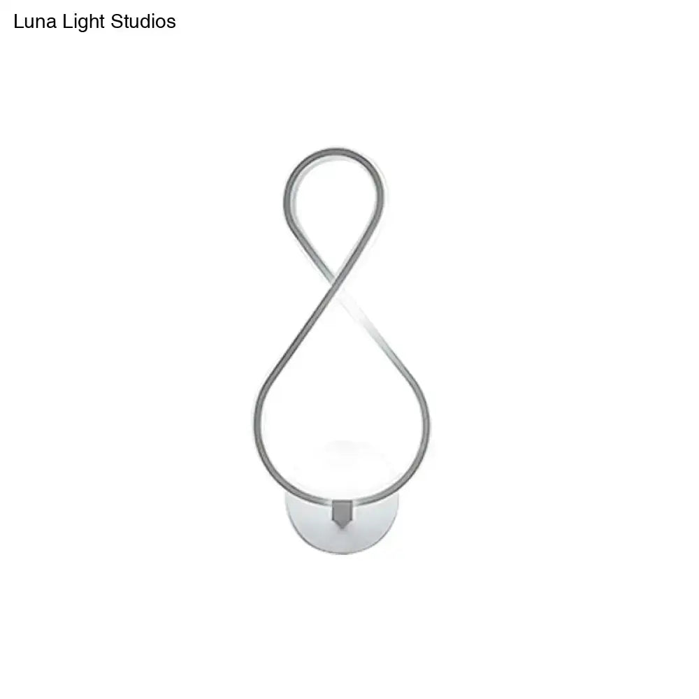 Modern infinity-shaped wall lamp with black and white acrylic led and sleek silver metallic frame for bedroom sconce