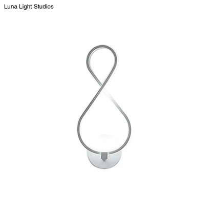 Modern infinity-shaped wall lamp with black and white acrylic led and sleek silver metallic frame for bedroom sconce