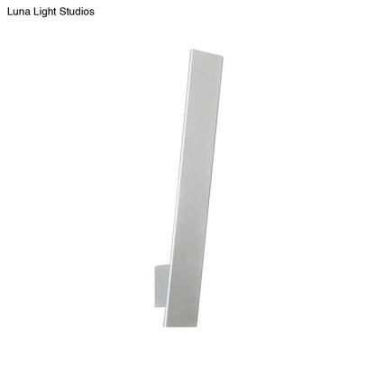 Minimalist white rectangular wall-mounted light fixture with aluminum shade and direct wired design for bedroom use