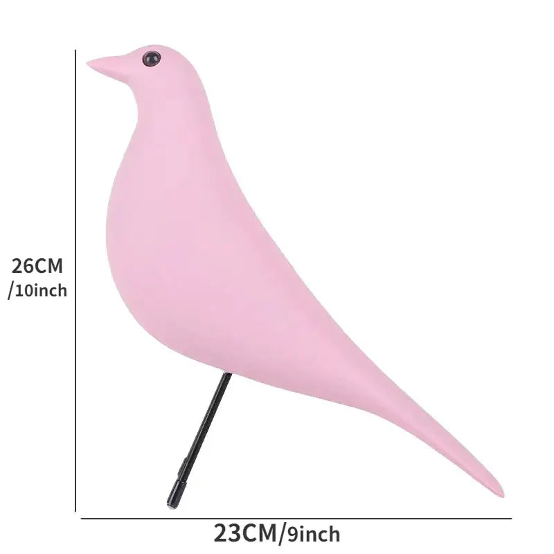 A sleek matte pink resin craft bird peace dove figurine on a slender black stand for minimalist decorbites decor