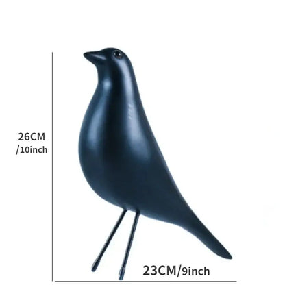 A sleek matte black resin craft bird peace dove figurine with minimalist design and slender legs for decorbites decor