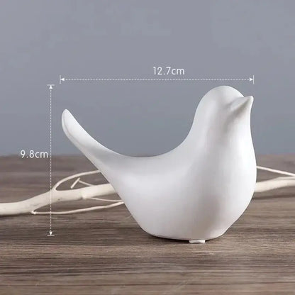 White ceramic bird figurine with smooth glossy finish in minimalist black and white bird figurine set for living room decor