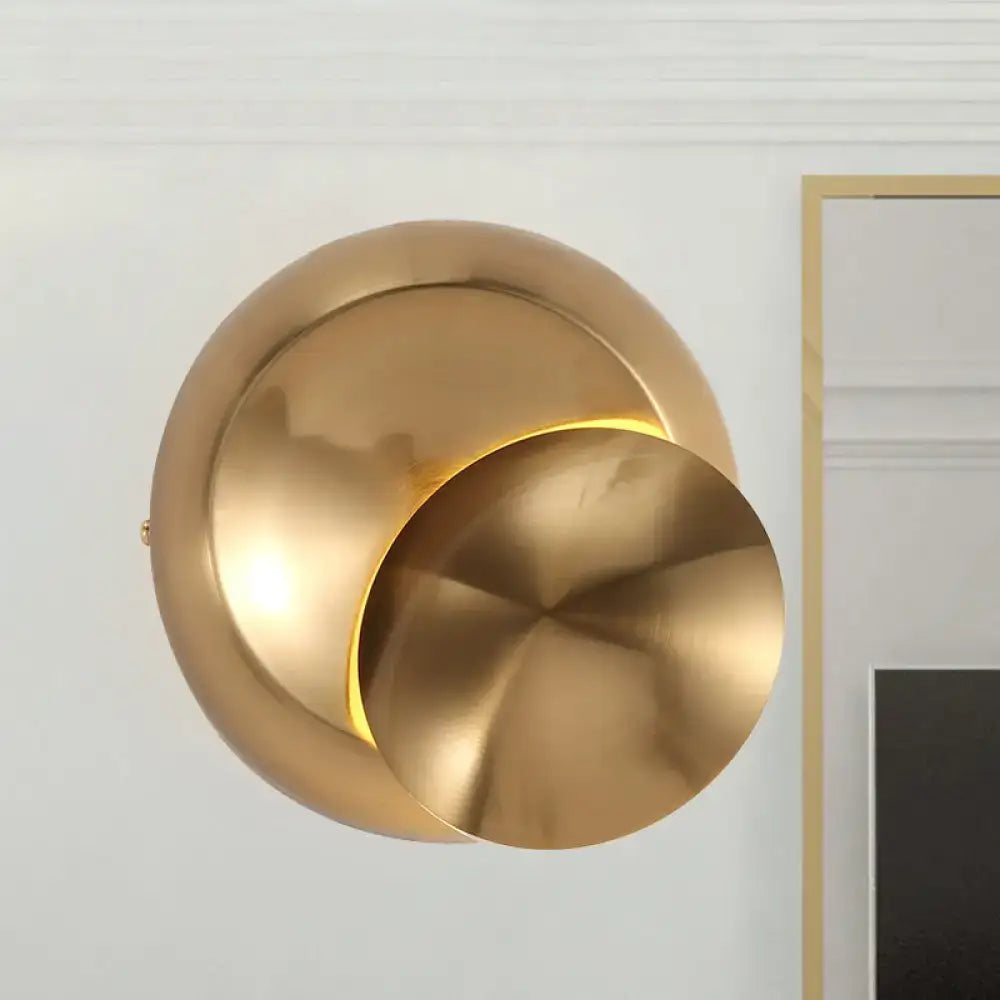 Modern gold-toned wall lamp with overlapping circular discs and warm light for stairway black white inch fixture