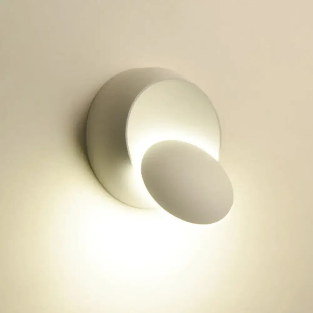 Modern black and white wall lamp featuring a sleek minimalist 12 inch fixture with two concentric circular LED shades for stairway use