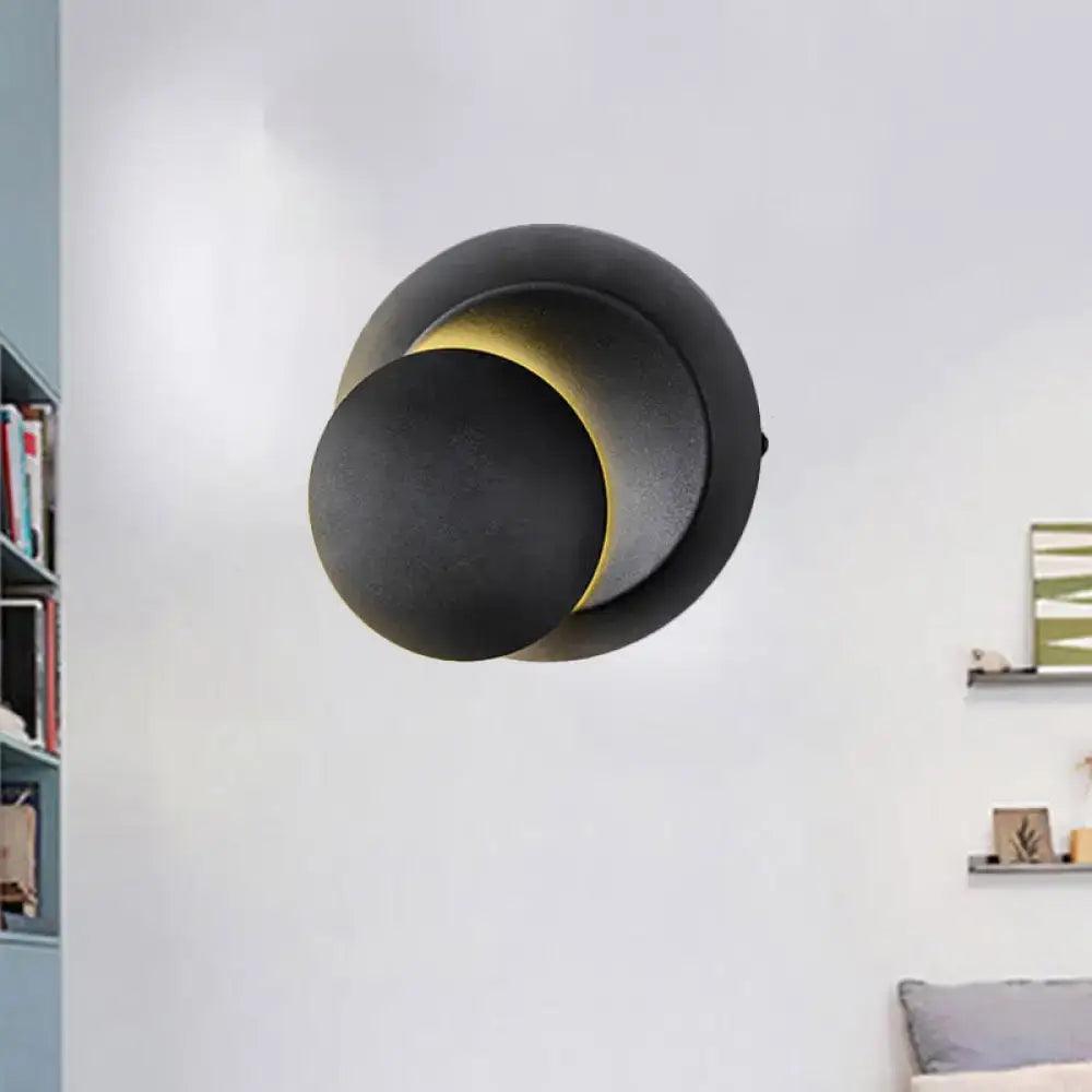 Minimalist black and white circular led wall lamp with a modern black matte inch fixture for stairway lighting
