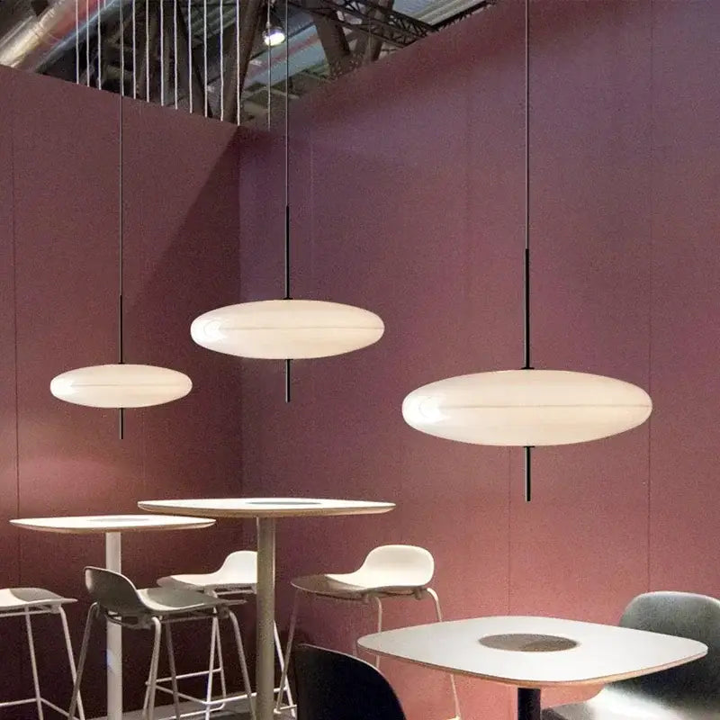 Modern white oval pendant light with sleek black cords by decorbites designer pendant light for dining room decor