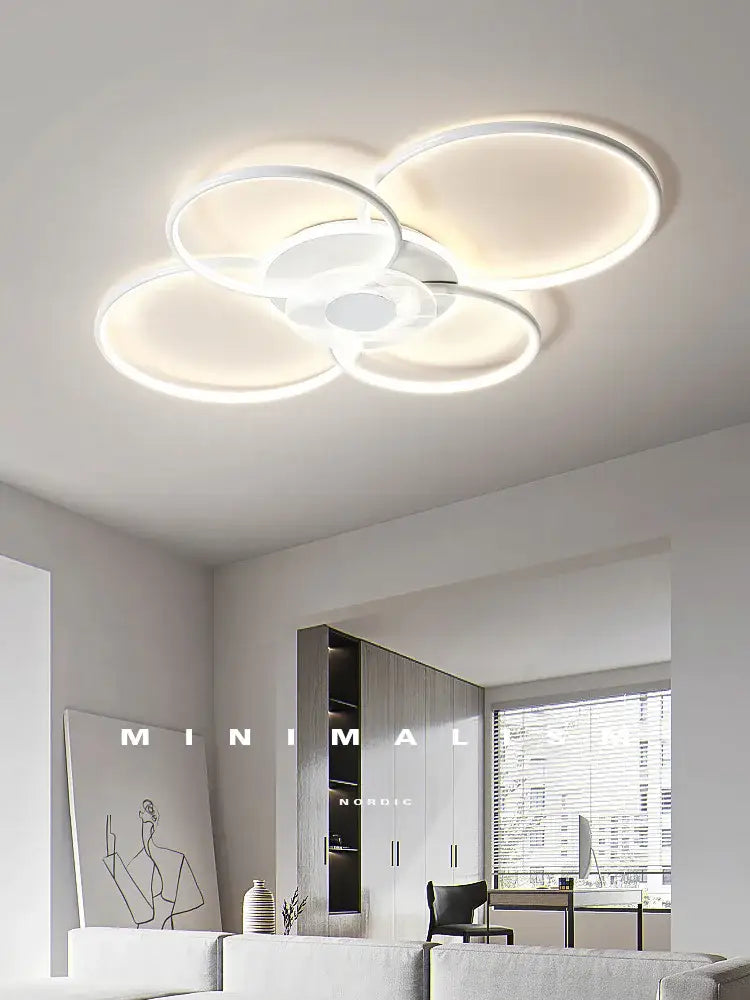 Modern white led ceiling lamp with overlapping circular rings and minimalist design for decorbites living room ceiling
