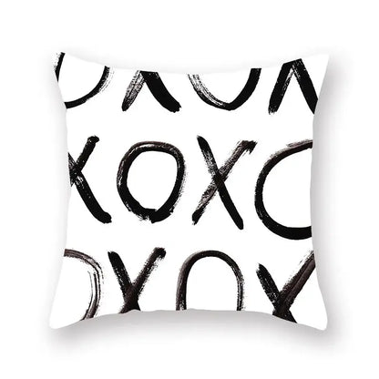 White throw pillow with bold black brushstroke xoxo pattern minimalist black geometric cushion cover for living room decor