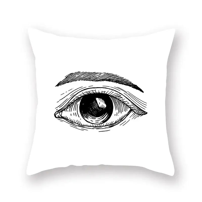 White throw pillow with a detailed black ink eye sketch featuring decorbites black geometric cushion cover design