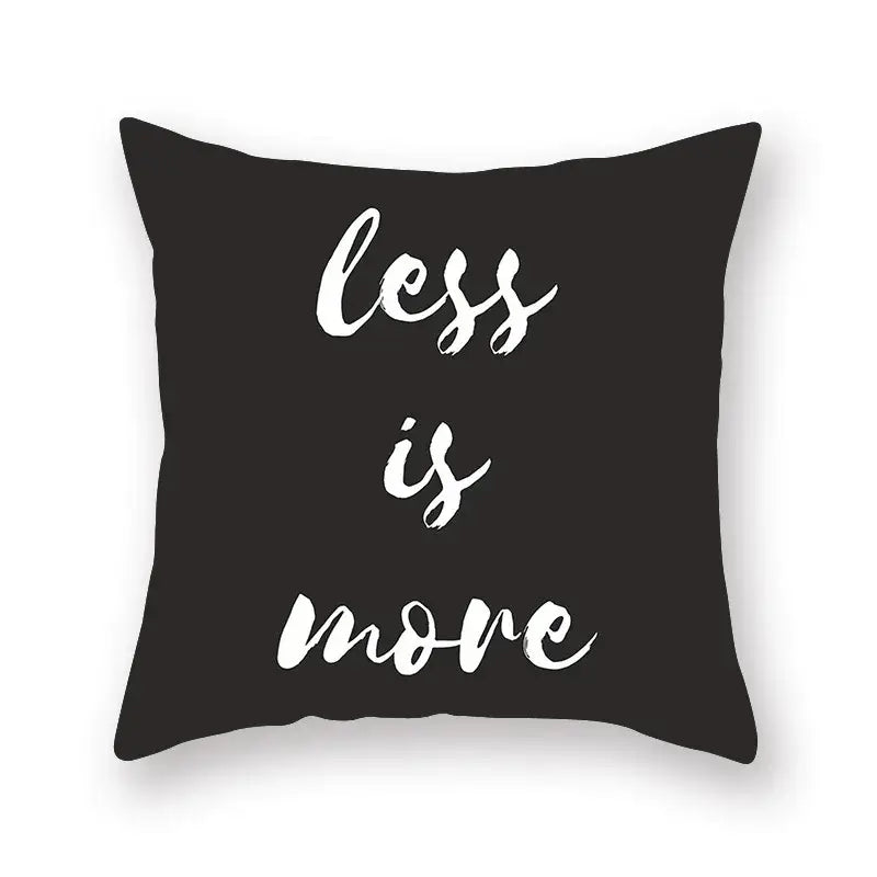 Minimalist black geometric cushion cover with white brushstroke text less is more for living room decorbites decor