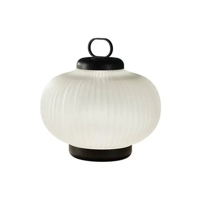 A minimalist black and white glass chandelier bedroom lantern light with an off-white ribbed white glass and black metal handle