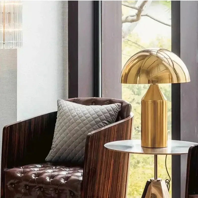 Golden dome-shaped table lamp with sleek metallic base from decorbites iron mushroom table for minimalist bedroom lighting