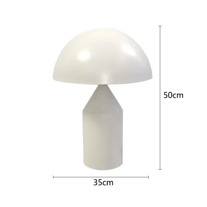 A sleek white decorbites iron mushroom table lamp with glossy dome shade and cylindrical base for bedroom lighting