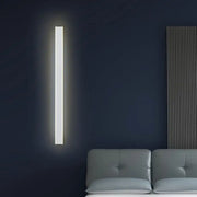 A sleek minimalist black and white led wall lamp with soft white illumination ideal for bedroom sconce lighting