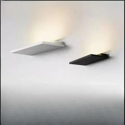 Minimalist black and white led wall light with flat rectangular design and angular edges for bedroom and living room decorbites led wall