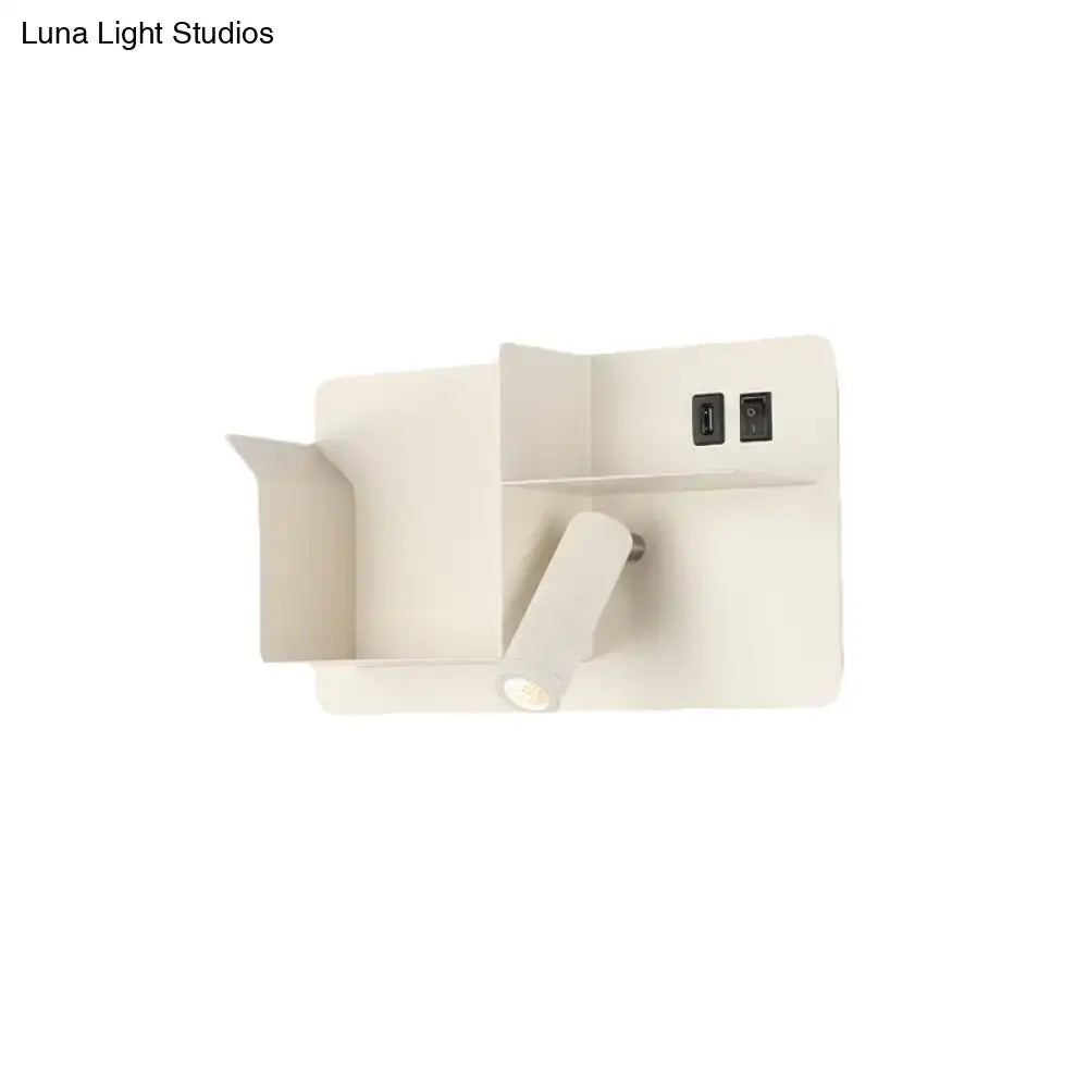 Minimalist black and white metal tubular wall light with bulb base and integrated usb ports for reading use