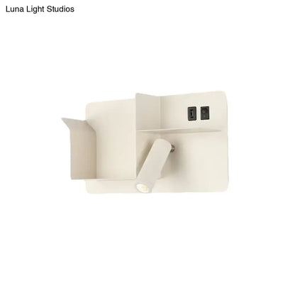 Minimalist black and white metal tubular wall light with bulb base and integrated usb ports for reading use