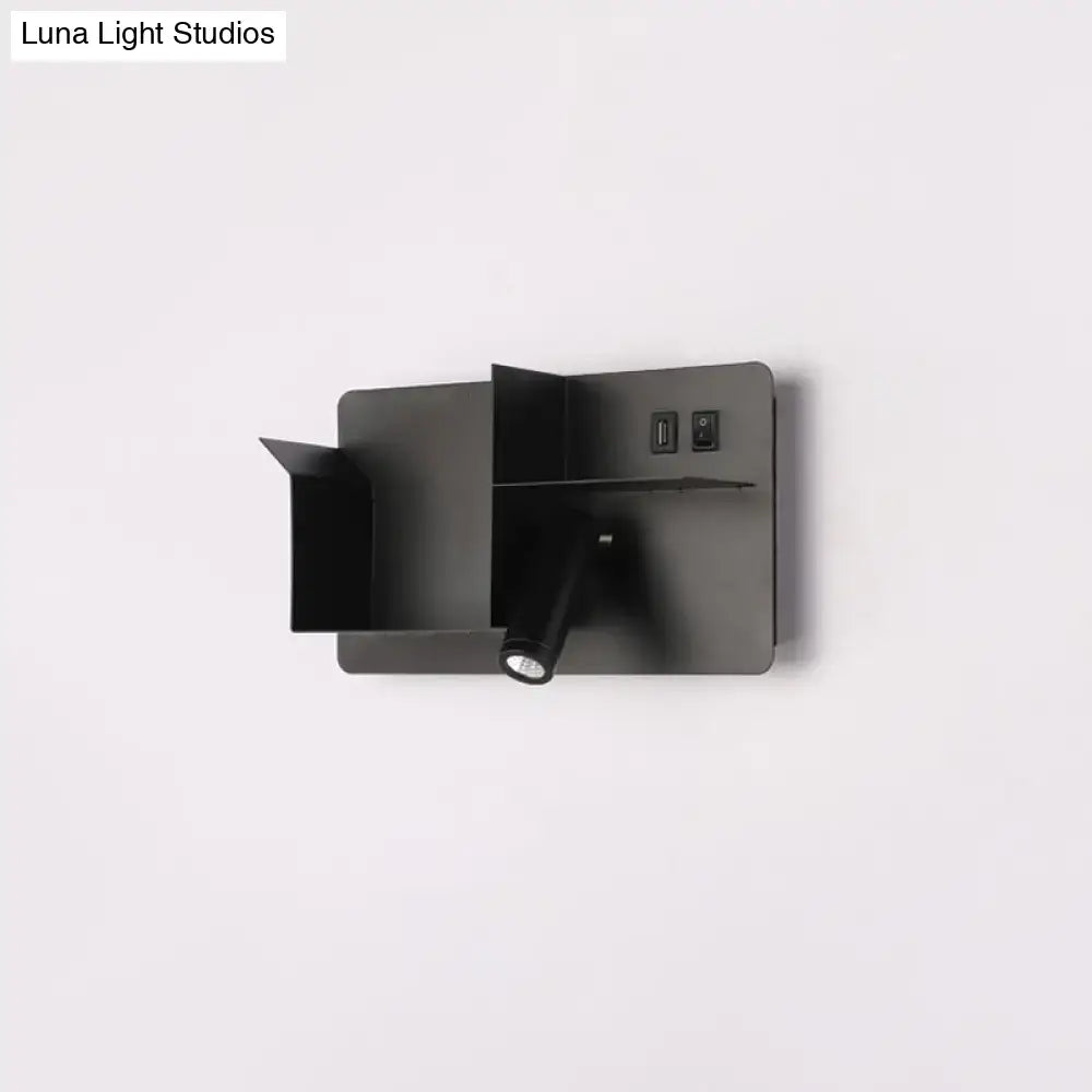 Minimalist black metal tubular wall light with matte finish, swivel head, bulb base, and integrated usb ports for reading