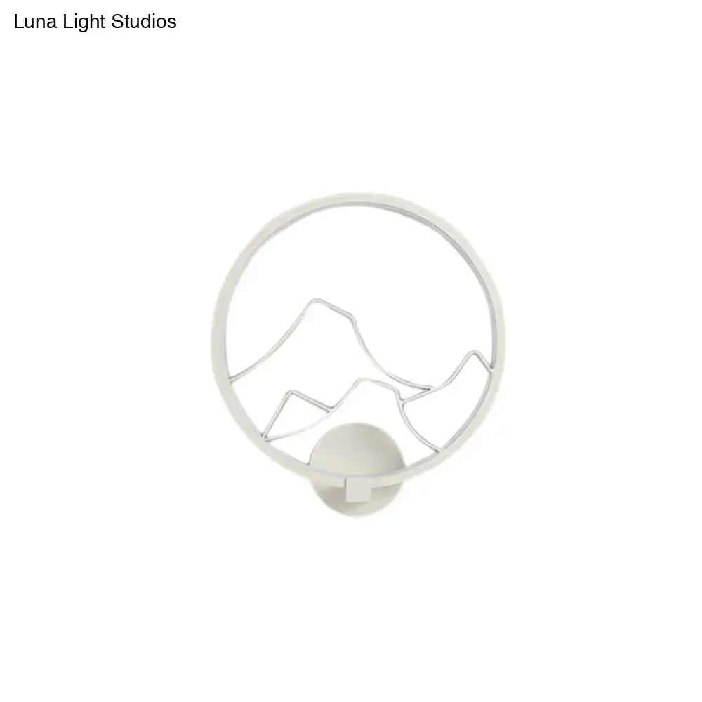 White circular acrylic ring wall lamp with minimalist black mountain silhouette for bedroom wall lamp decor