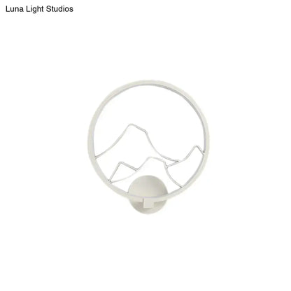 White circular acrylic ring wall lamp with minimalist black mountain silhouette for bedroom wall lamp decor