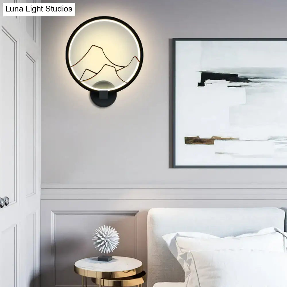Minimalist black circular wall lamp with integrated led light and acrylic ring design for bedroom use