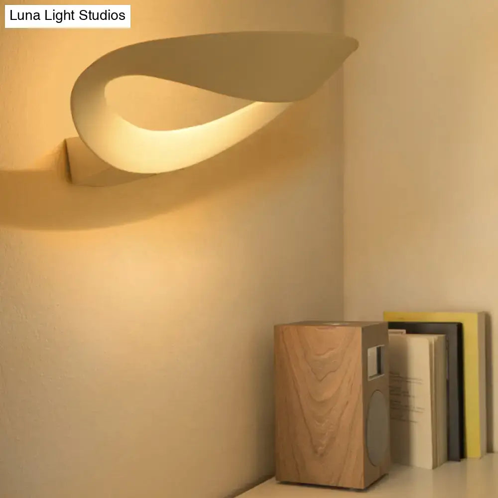 Cream-colored minimalist oval wall sconce with integrated led bulb sleek modern wall light for bedroom use