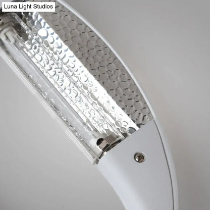 Minimalist black and white oval led wall sconce with white curved textured glass panel and metallic accents wall light with integrated led bulb