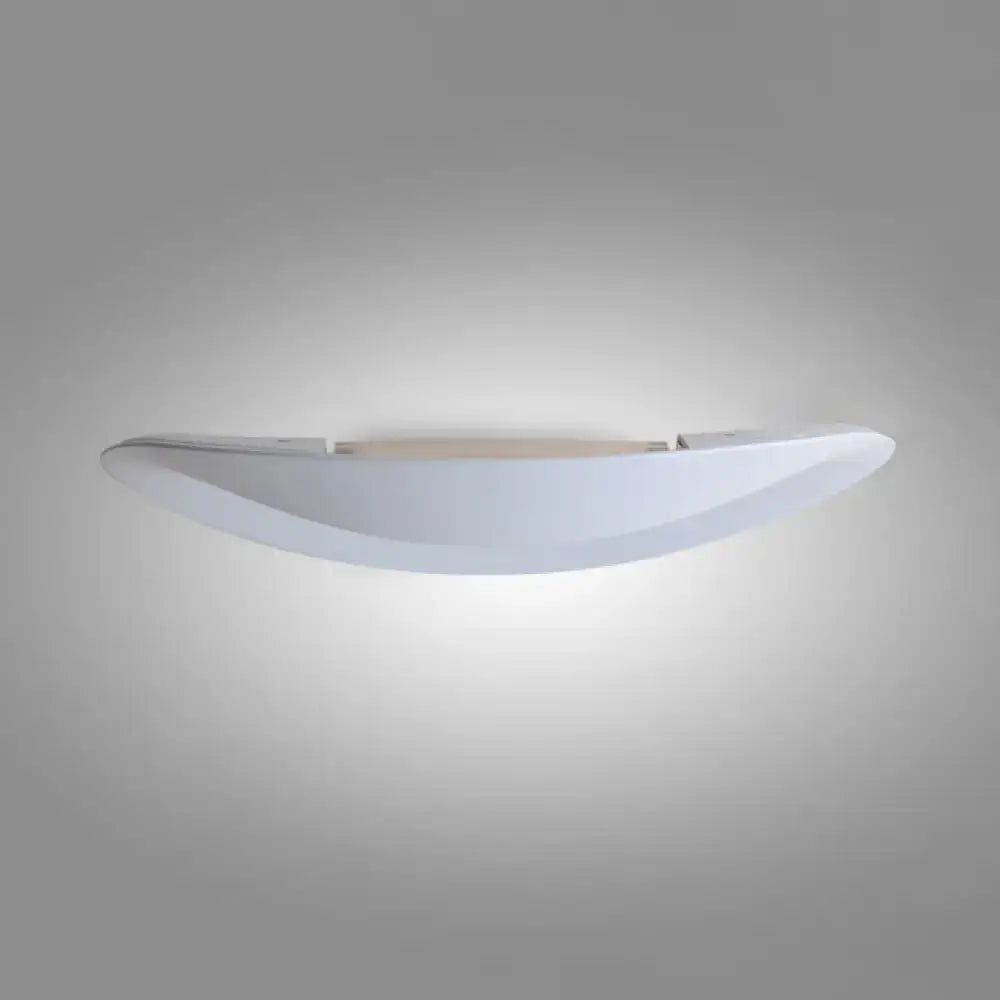 Minimalist black and white oval wall sconce with integrated led bulb and sleek curved design for bedroom wall light