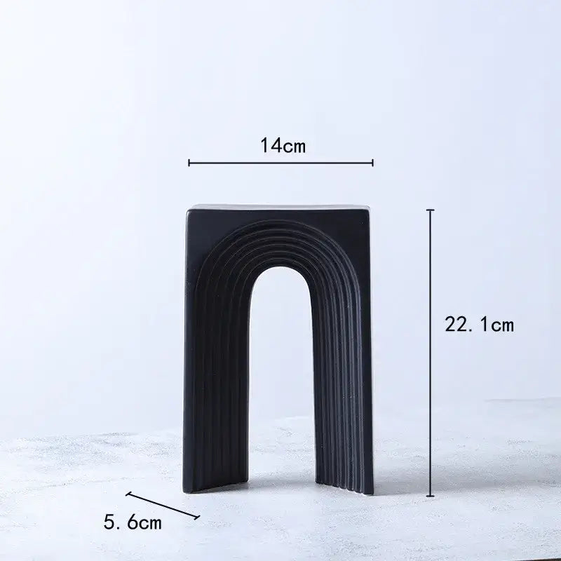 Black ceramic semicircular arch bookend with sleek vertical ridges for minimalist living room decorbites geometric ceramic display