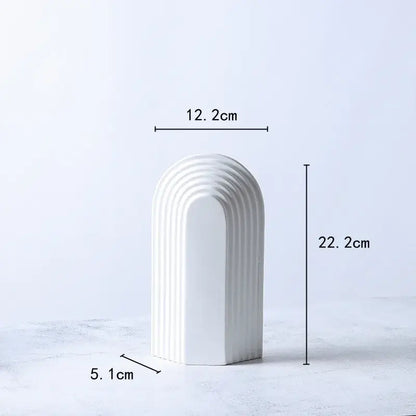 White ceramic vase with tall arched semicircular design and vertical ridges for minimalist decorbites geometric ceramic decorbites