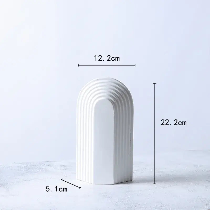 White ceramic vase with tall arched semicircular design and vertical ridges for minimalist decorbites geometric ceramic decorbites