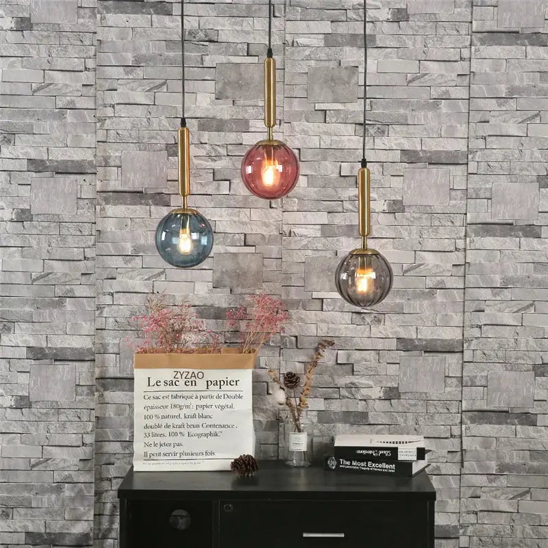 Minimalist glass ball pendant light with brass rods in blue pink and smoky gray for living room decorbites glass ball