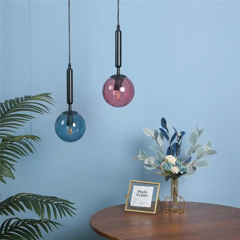 Minimalist blue and pink glass ball pendant light with black stems for living room decorbites glass ball pendant