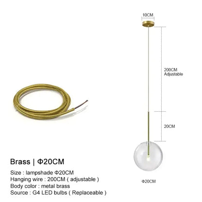 A minimalist brass pendant light with a clear glass ball designed for dining room decorbites clear glass style