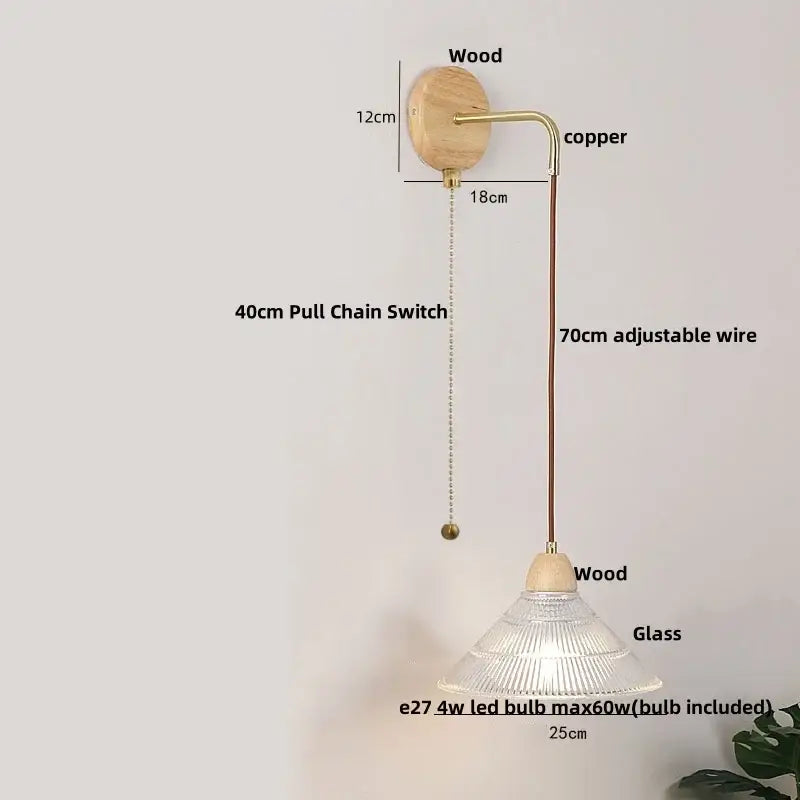 Minimalist wall light with natural wood base copper arm clear glass shade and adjustable 70cm wire decorbites clear glass