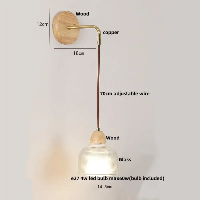 Minimalist wall light with natural wood base copper arm and decorbites clear glass ribbed shade and pull chain switch