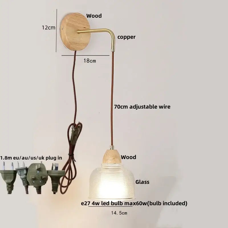 A warm-toned copper and wood wall light with a ribbed clear glass shade featuring decorbites clear glass design