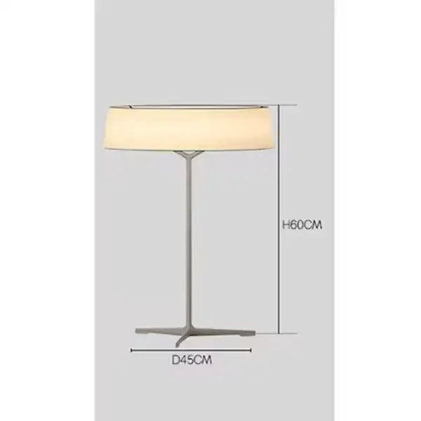 A sleek minimalist dama pendant lamp with brass frame and off-white fabric shade ideal for kitchen lighting