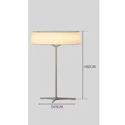 A sleek minimalist dama pendant lamp with brass frame and off-white fabric shade ideal for kitchen lighting