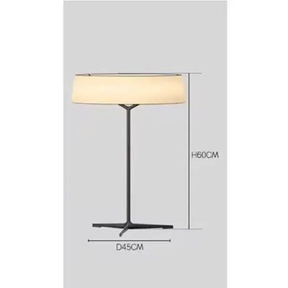 Black metal floor lamp with cylindrical off-white fabric shade complementing minimalist dama pendant lamp design