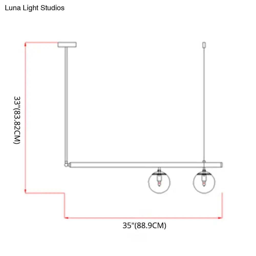 Modern minimalist ceiling light with white glass globe shades and brass frame for kitchen island by luna light studios